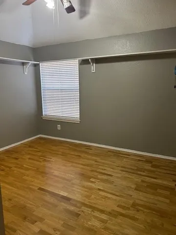a view of an empty room with windows