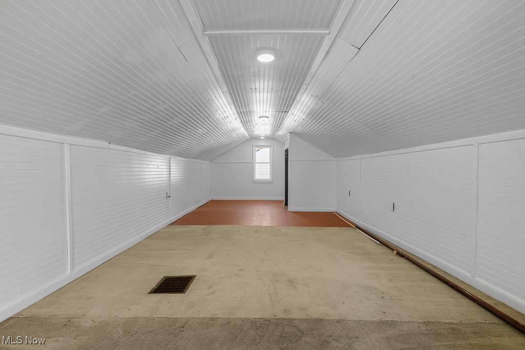1702 Far View Road Akron, OH 44312 - Photo 26 of 49 Additional living space with lofted ceiling and carpet