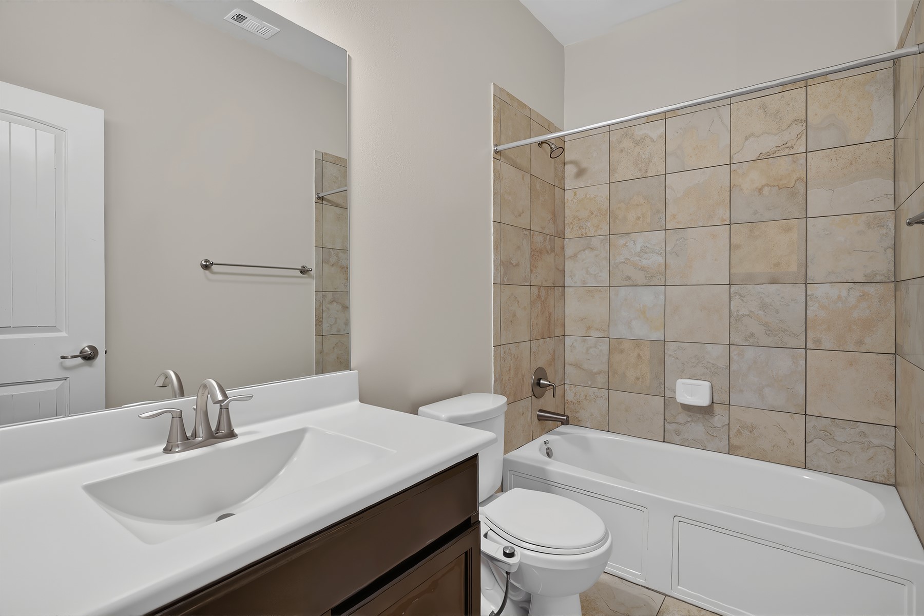 4601 Chestnut Meadows Bend Georgetown, TX 78626 - Photo 14 of 35 A well-appointed bathroom features a single vanity, classic tiled tub, and an overall clean, crisp aesthetic.