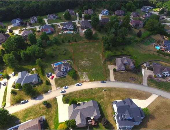 an aerial view of houses with yard