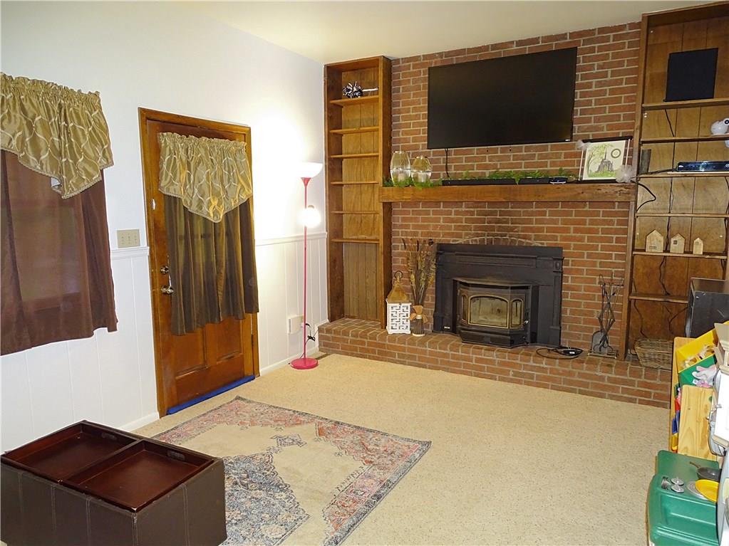 865 Edgewood Road Beaver Falls, PA 15010 - Photo 11 of 24 The family room has a wood-burning fireplace for those chilly winter nights.