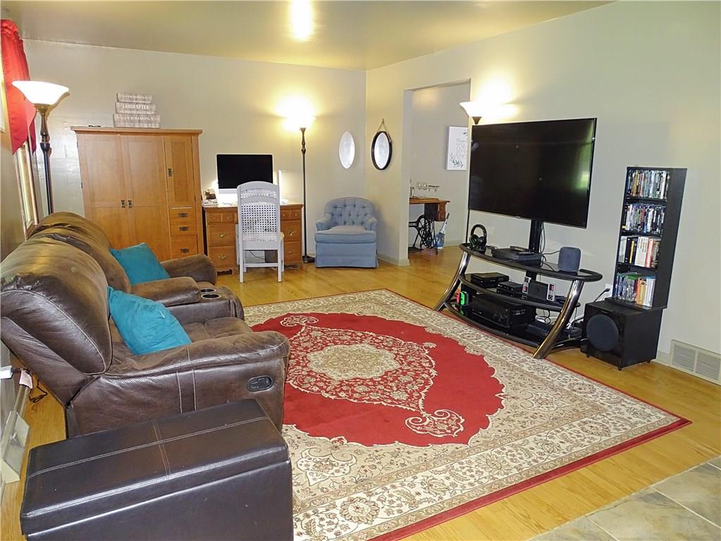 865 Edgewood Road Beaver Falls, PA 15010 - Photo 6 of 24 Living room with hardwood floors and a tile entryway to keep the hardwoods clean.