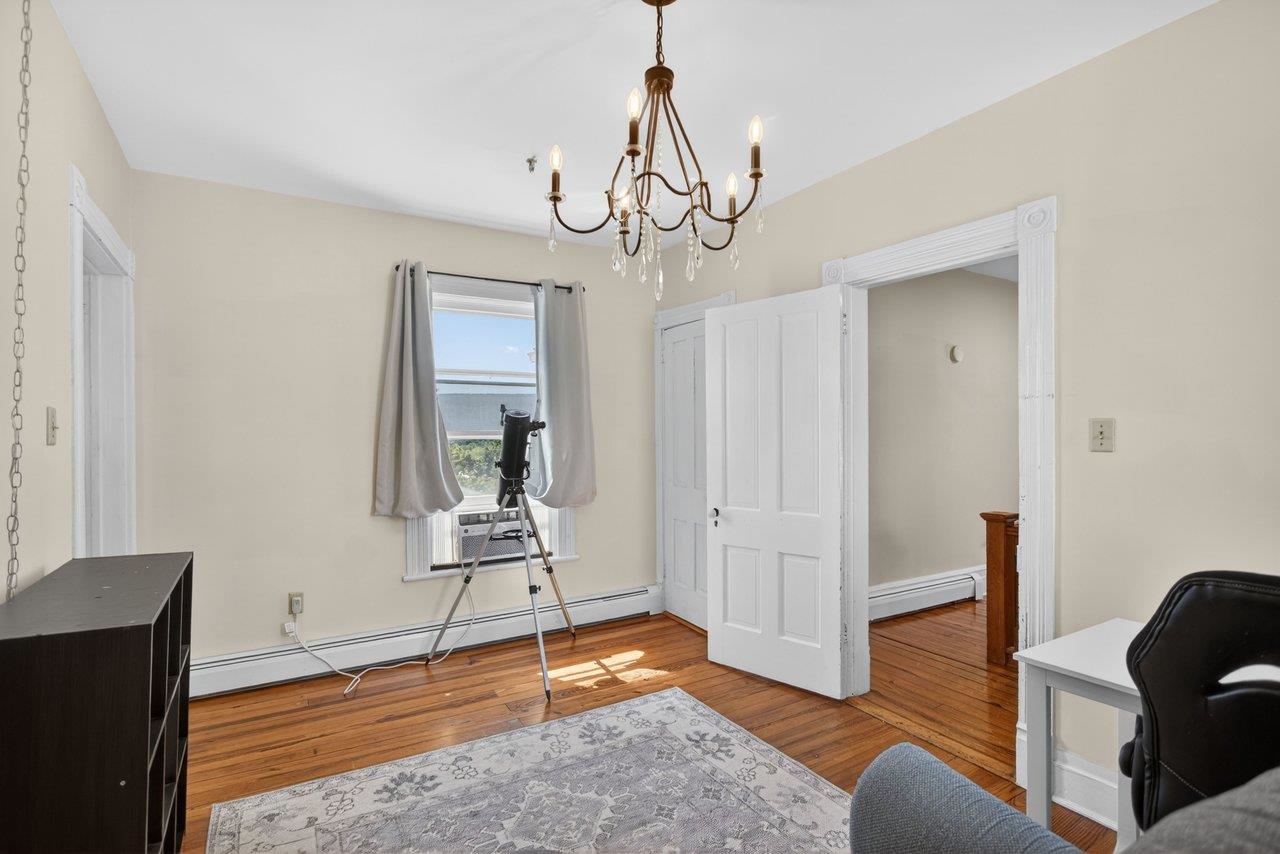 420 West Spring Street Woodstock, VA 22664 - Photo 42 of 67 a view of a livingroom with wooden floor and a chandelier