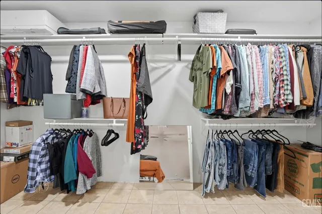 a bedroom with furniture and a ceiling fan