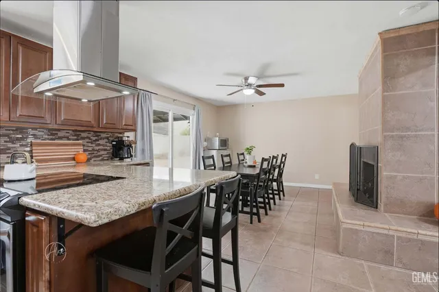 a living room with furniture a large window and a clock