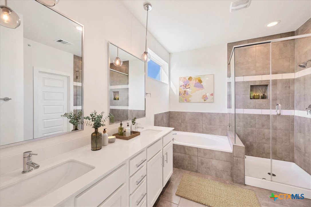 8922 Manchaca Road, Unit 906 Austin, TX 78748 - Photo 5 of 16 a bathroom with a tub sink and mirror