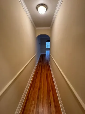 a view of balcony with wooden floor
