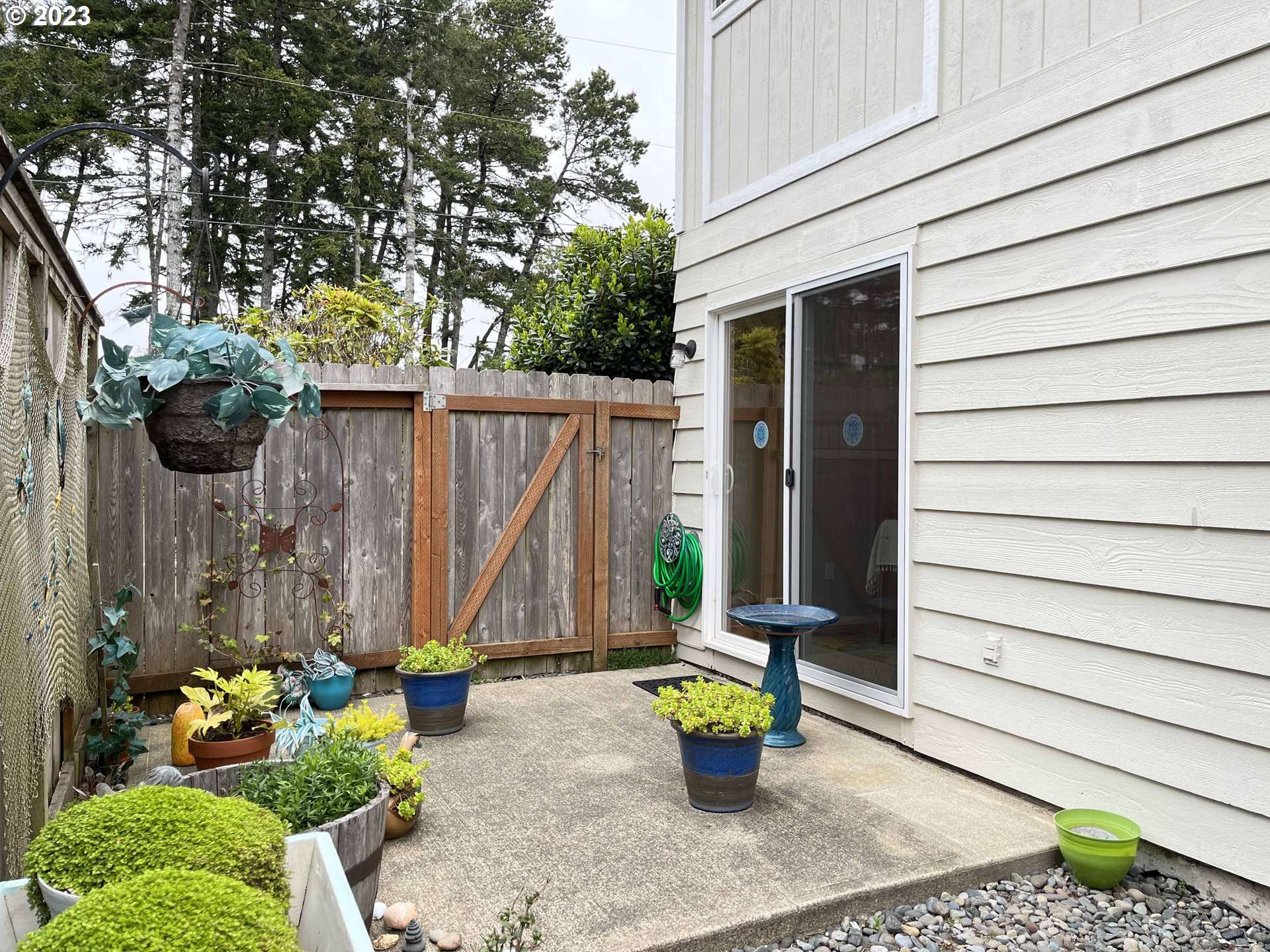 1340 9th Street, Unit 4 Florence, OR 97439 - Photo 17 of 31 a view of small house with patio