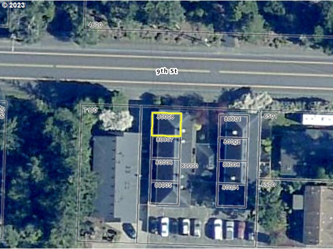 1340 9th Street, Unit 4 Florence, OR 97439 - Photo 31 of 31 a front view of a building with a front door and windows