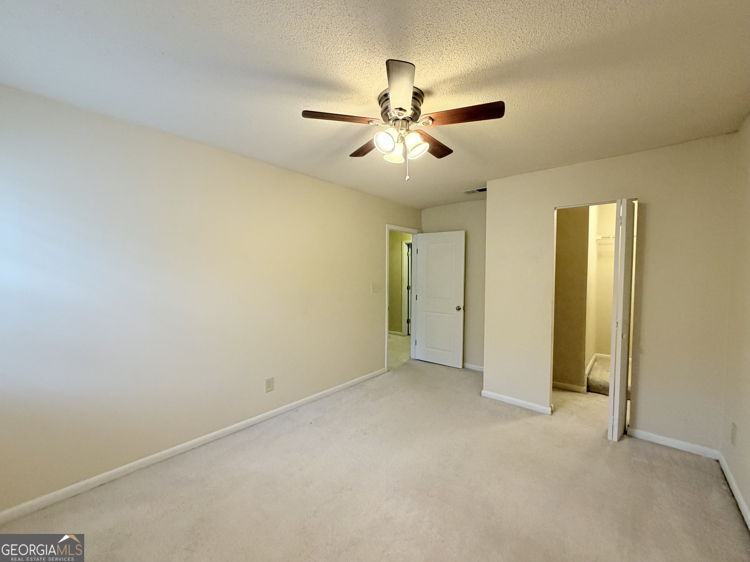 6900 Roswell Road Atlanta, GA 30328 - Photo 13 of 19 a view of an empty room and chandelier fan