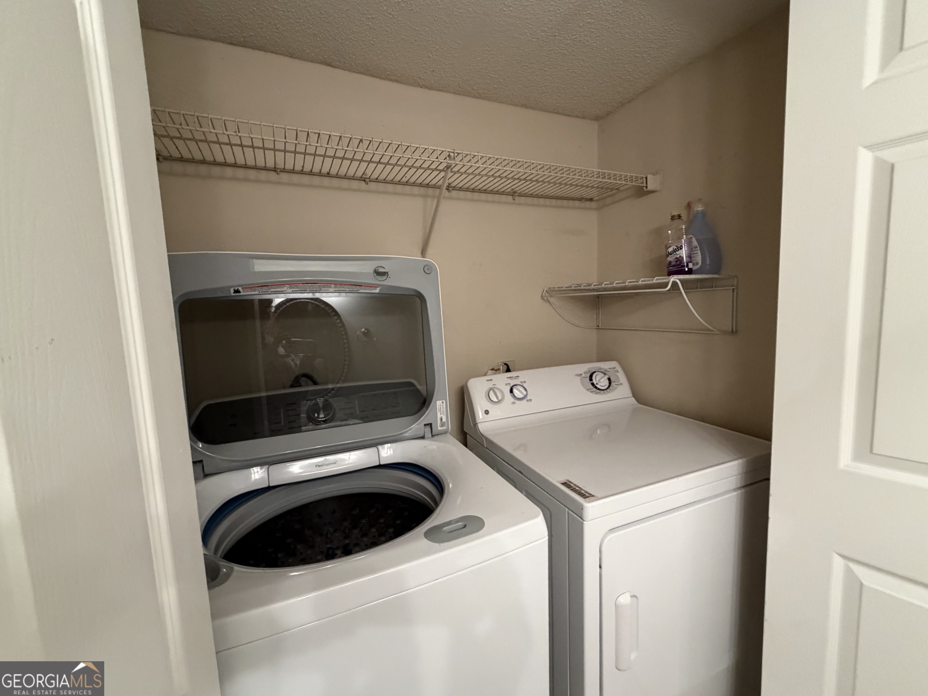 6900 Roswell Road Atlanta, GA 30328 - Photo 8 of 19 a utility room with dryer and washer