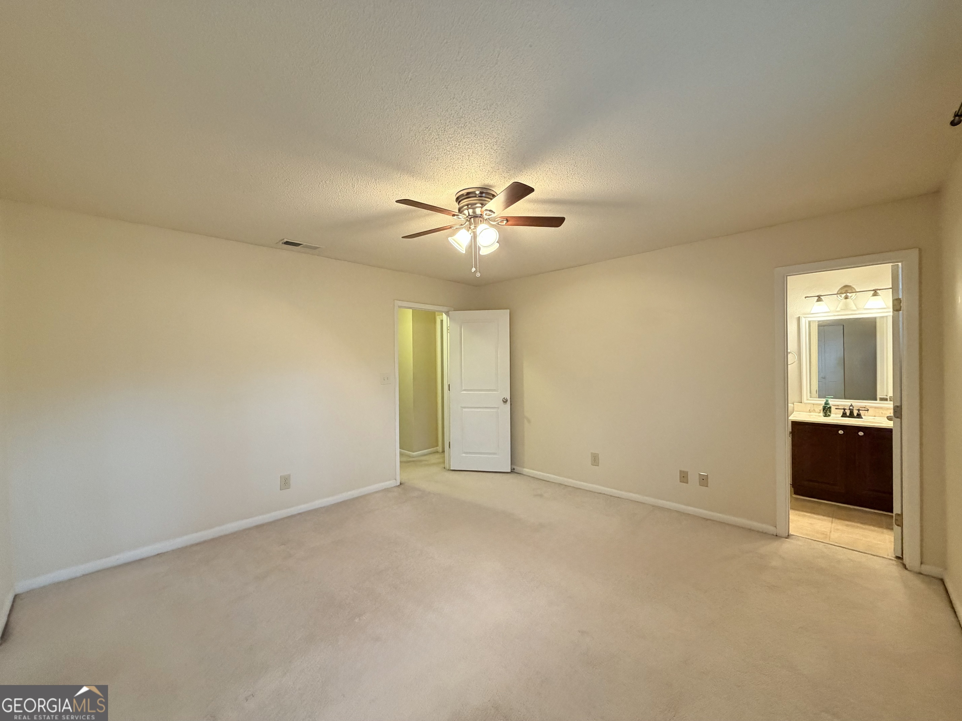 6900 Roswell Road Atlanta, GA 30328 - Photo 10 of 19 an empty room with fan and windows