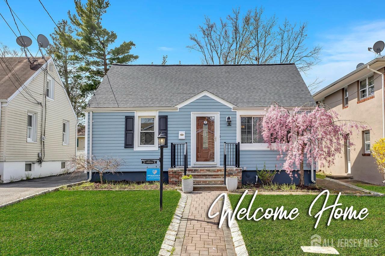 123 Highfield Road Colonia, NJ 07067 - Photo 1 of 30 a front view of a house with a garden