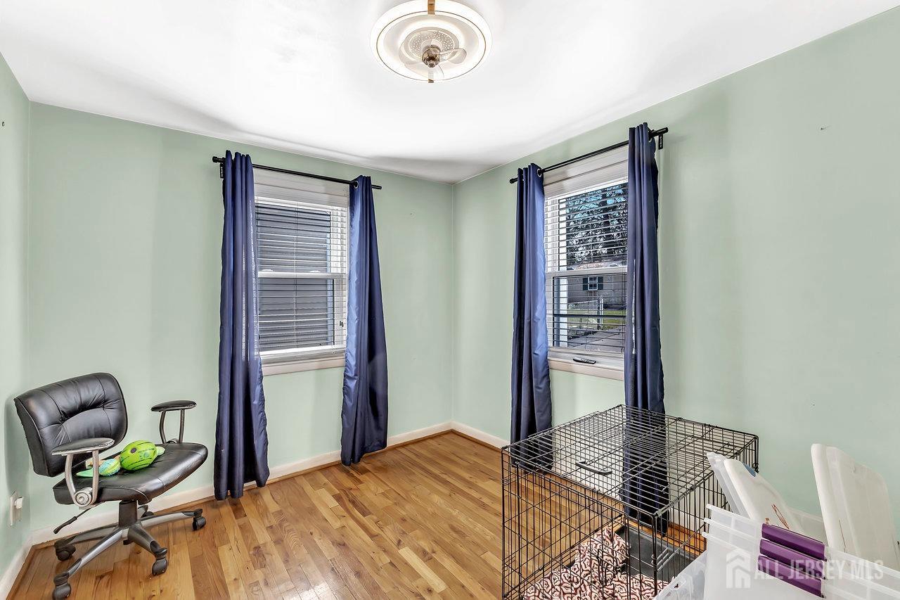 123 Highfield Road Colonia, NJ 07067 - Photo 11 of 30 a bedroom with a bed and a chair
