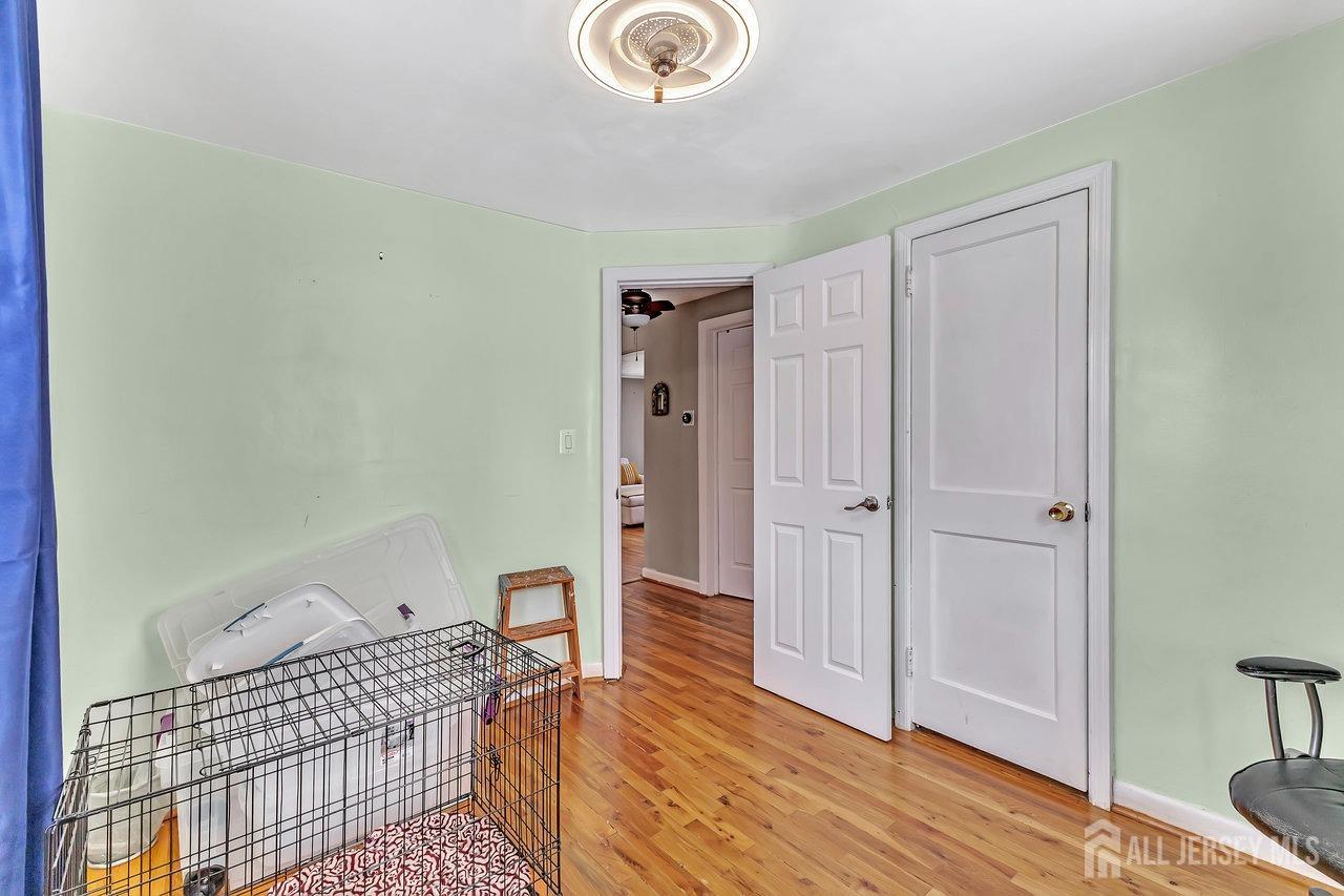 123 Highfield Road Colonia, NJ 07067 - Photo 12 of 30 a bedroom with a bed and a table