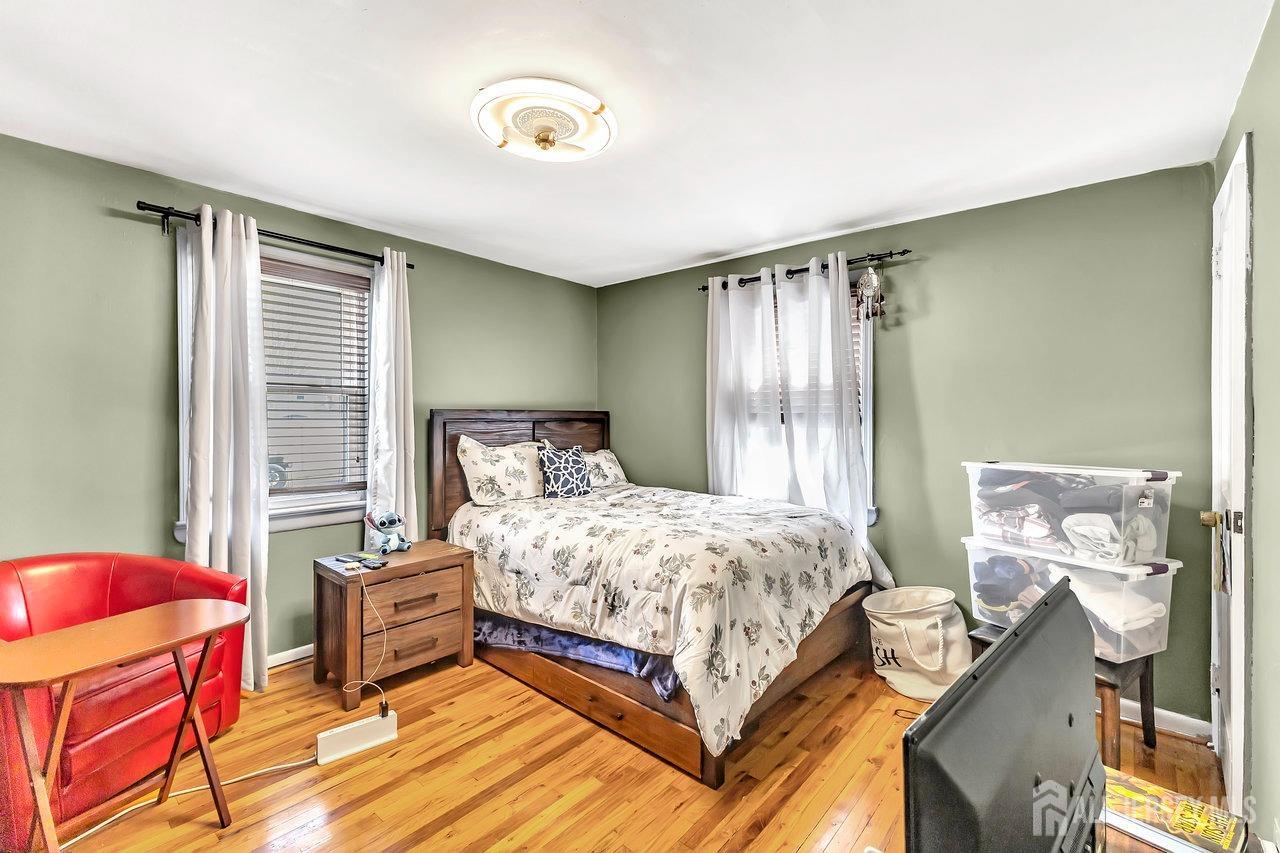123 Highfield Road Colonia, NJ 07067 - Photo 14 of 30 a bedroom with a bed and a window