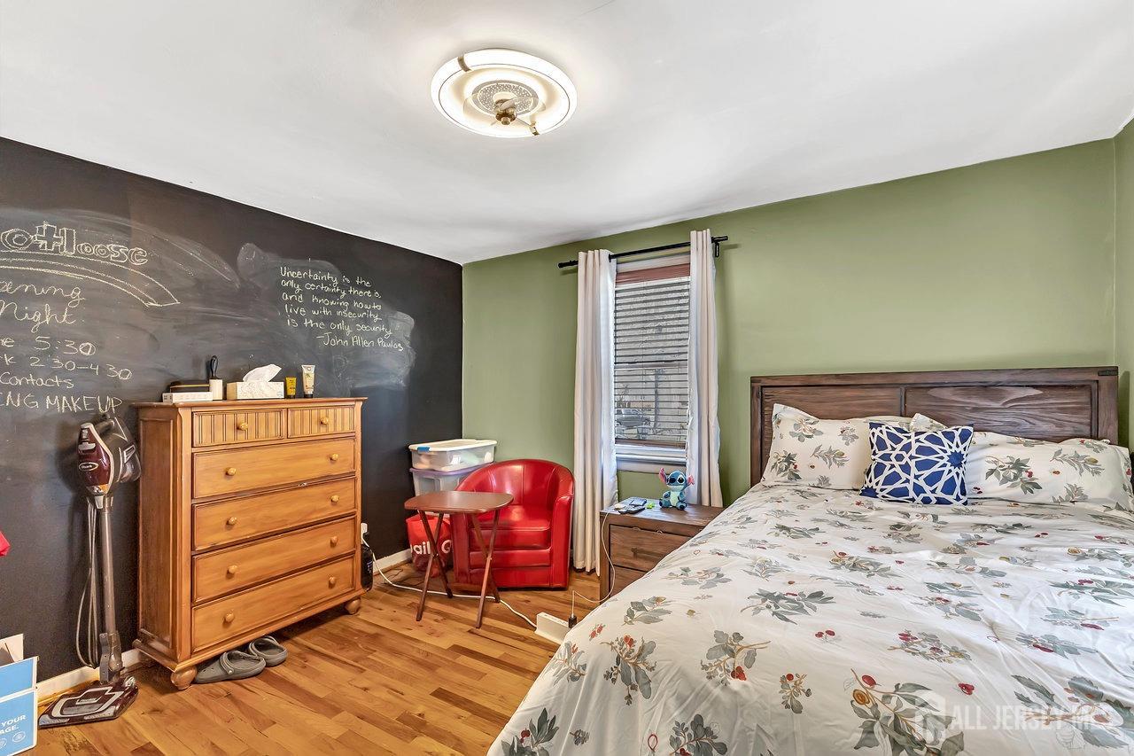 123 Highfield Road Colonia, NJ 07067 - Photo 15 of 30 a bedroom with a bed and a closet