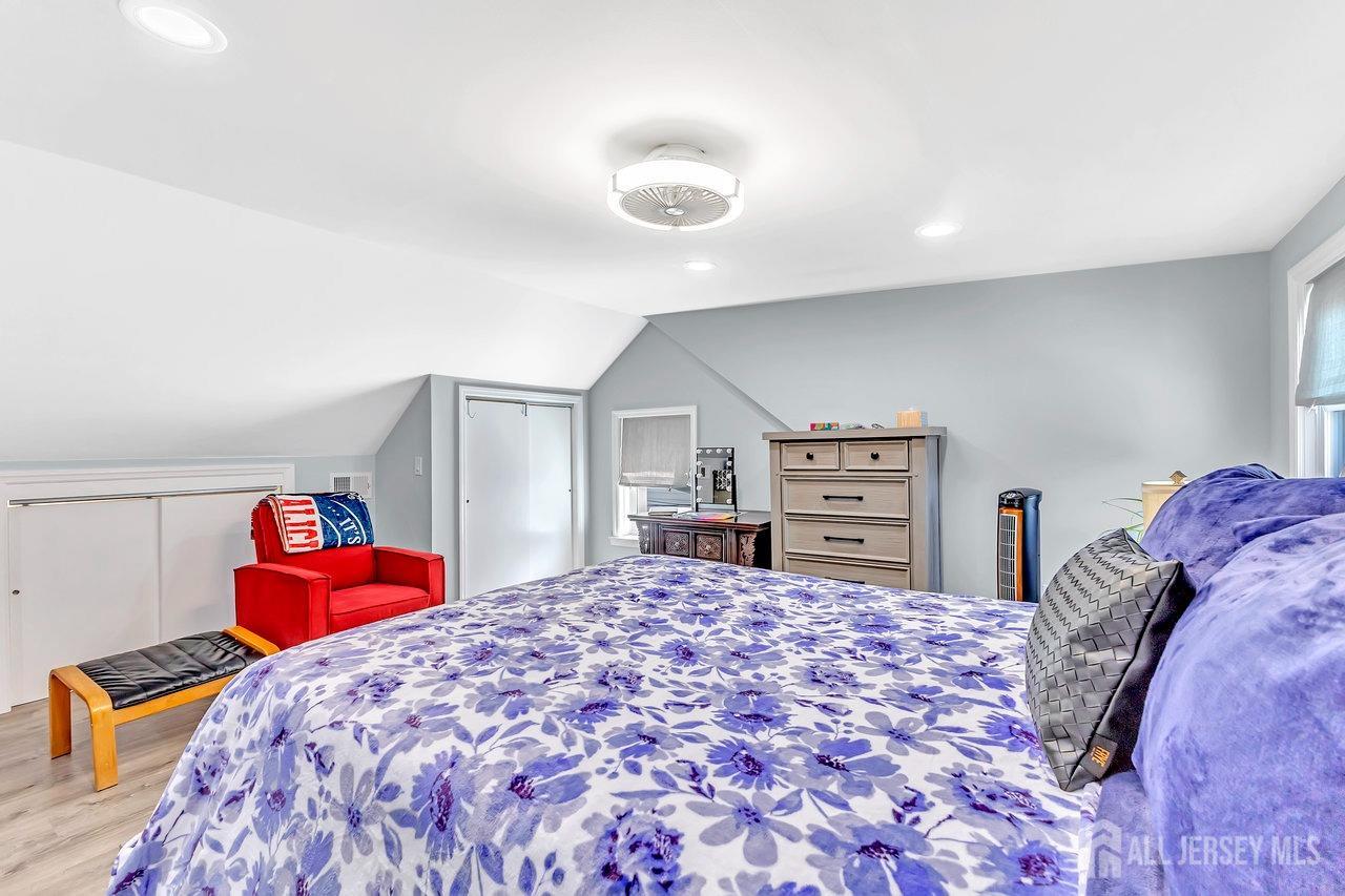 123 Highfield Road Colonia, NJ 07067 - Photo 18 of 30 a bedroom with a bed and dresser