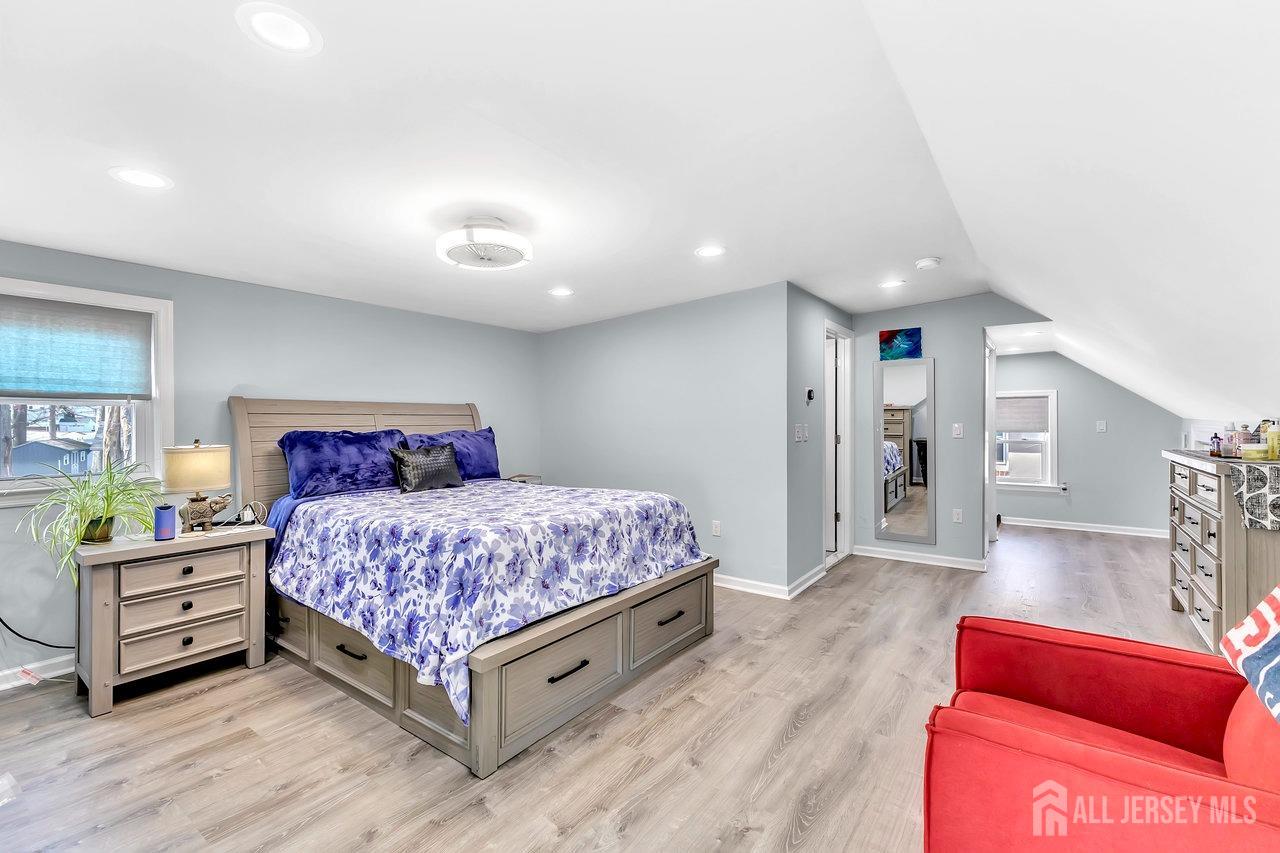 123 Highfield Road Colonia, NJ 07067 - Photo 19 of 30 a bedroom with a bed and a couch