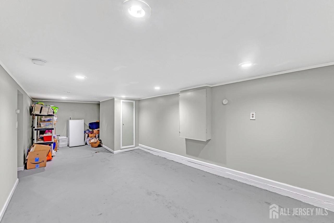 123 Highfield Road Colonia, NJ 07067 - Photo 21 of 30 an empty room with toys and wooden floor