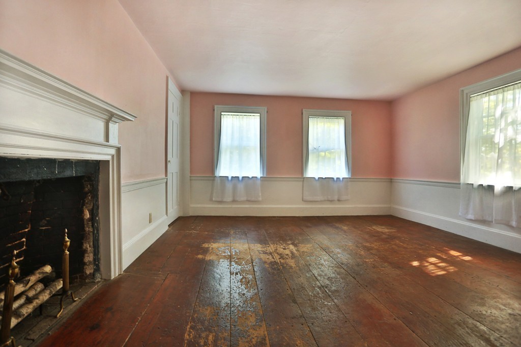 82 Baldpate Road Boxford, MA 01921 - Photo 10 of 20 an empty room with wooden floor and windows