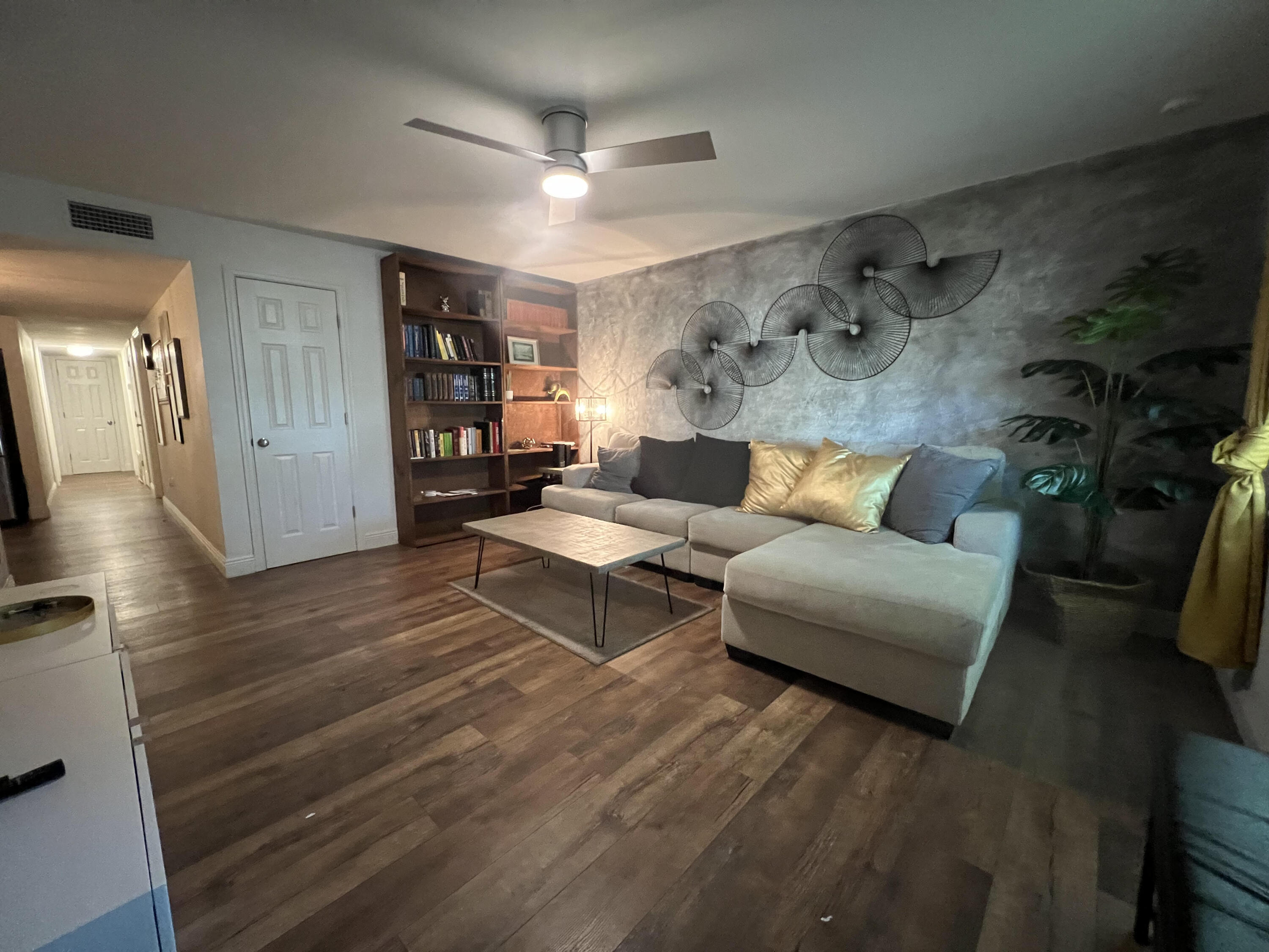 2807 South Vassar Street Melbourne, FL 32901 - Photo 2 of 12 a living room with furniture and a wooden floor