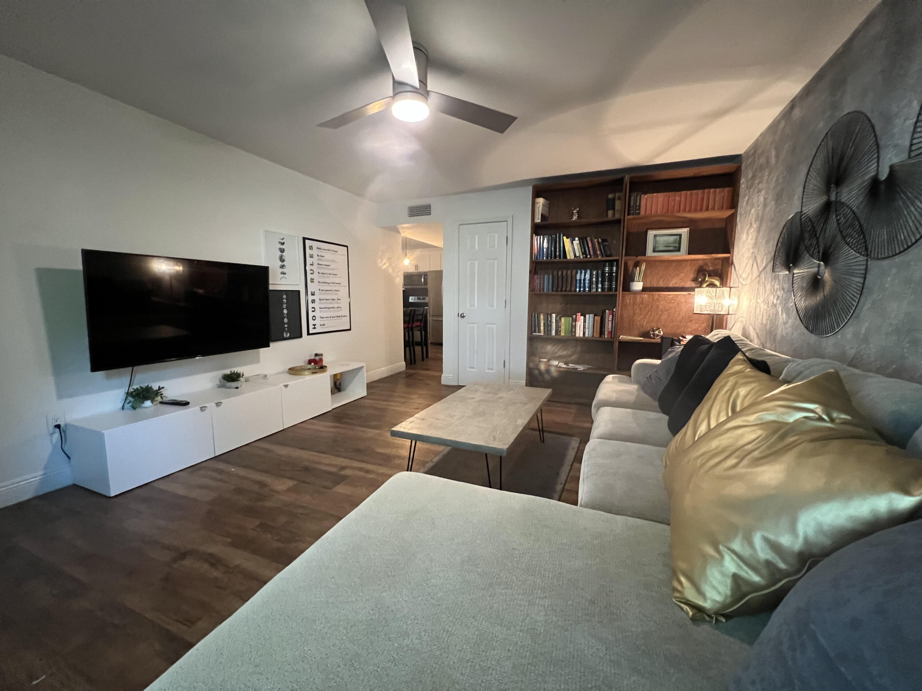 2807 South Vassar Street Melbourne, FL 32901 - Photo 3 of 12 a living room with furniture and a flat screen tv