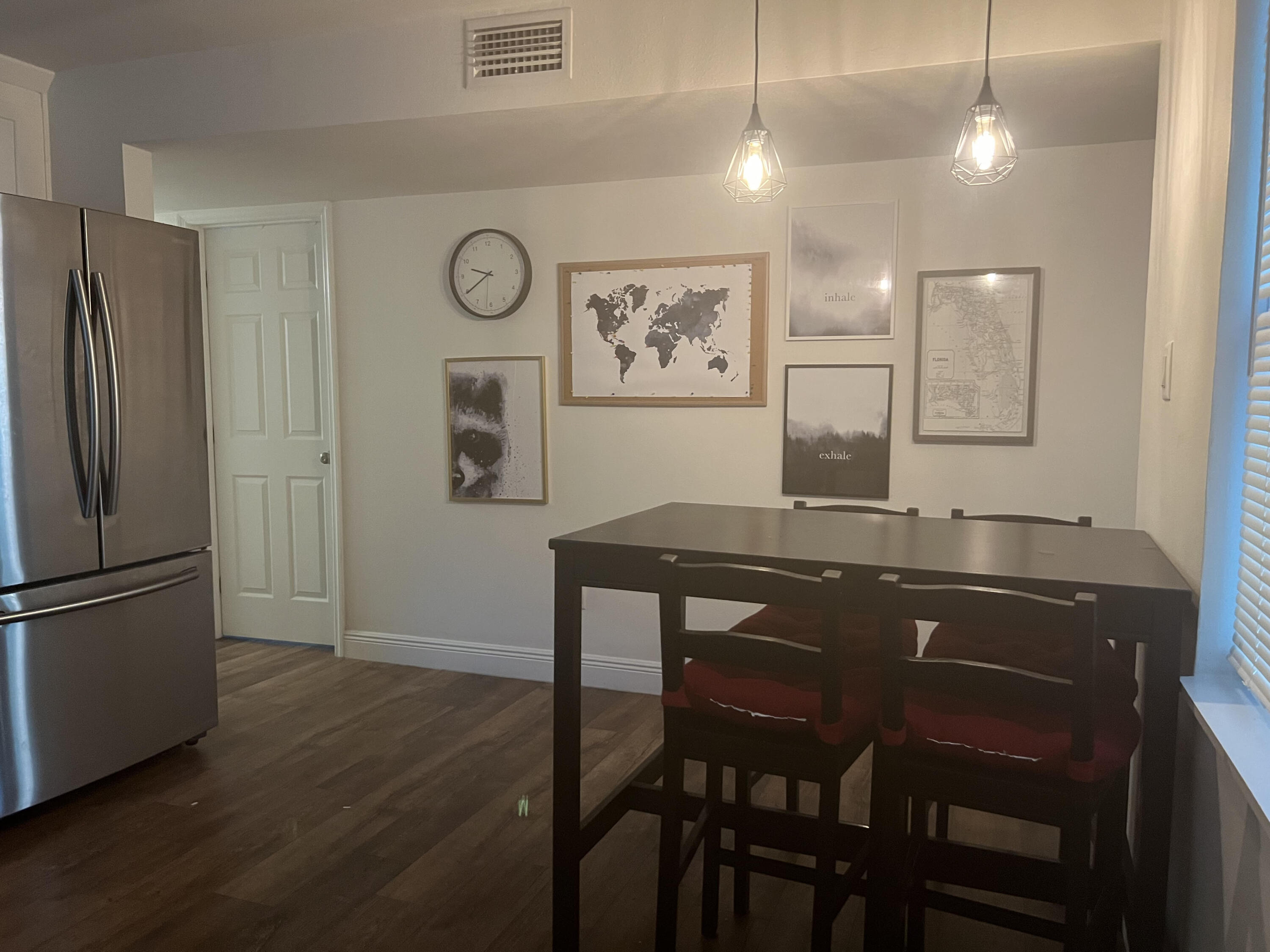 2807 South Vassar Street Melbourne, FL 32901 - Photo 7 of 12 a kitchen with a table and refrigerator