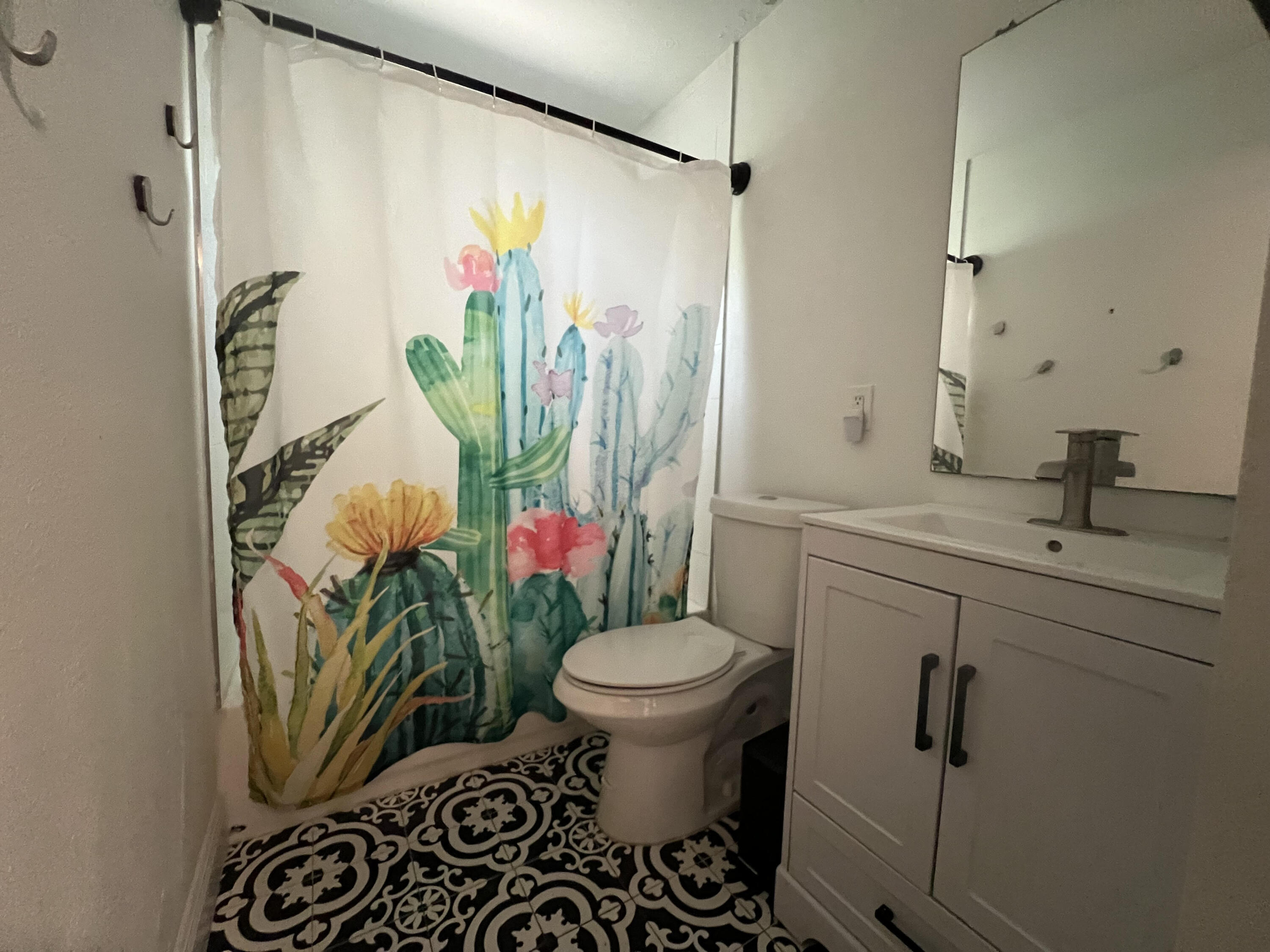 2807 South Vassar Street Melbourne, FL 32901 - Photo 10 of 12 a bathroom with a sink toilet and shower
