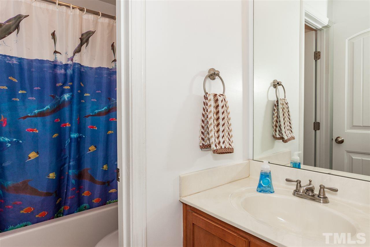 109 Leighann Ridge Lane Rolesville, NC 27571 - Photo 22 of 25 a bathroom with a sink vanity and a mirror