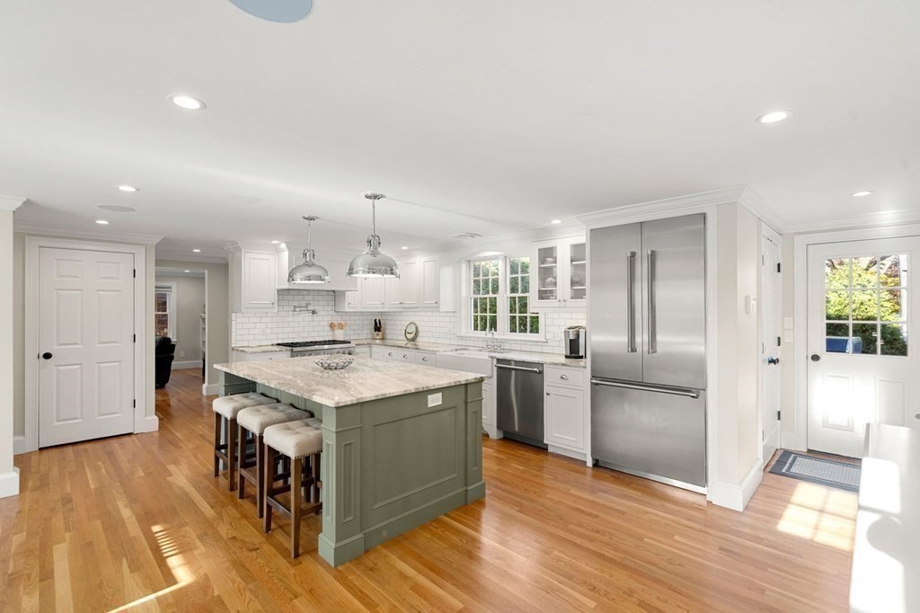 20 Shetland Road Marblehead, MA 01945 - Photo 12 of 40 a kitchen with stainless steel appliances granite countertop a stove and a refrigerator