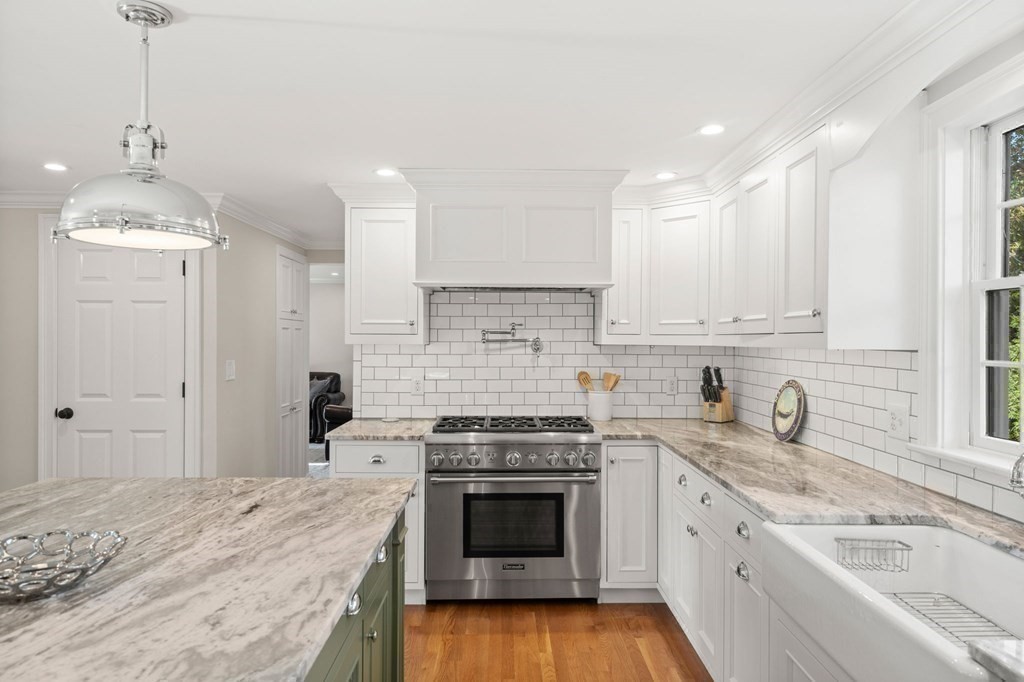 20 Shetland Road Marblehead, MA 01945 - Photo 13 of 40 a kitchen with granite countertop a sink stainless steel appliances and white cabinets