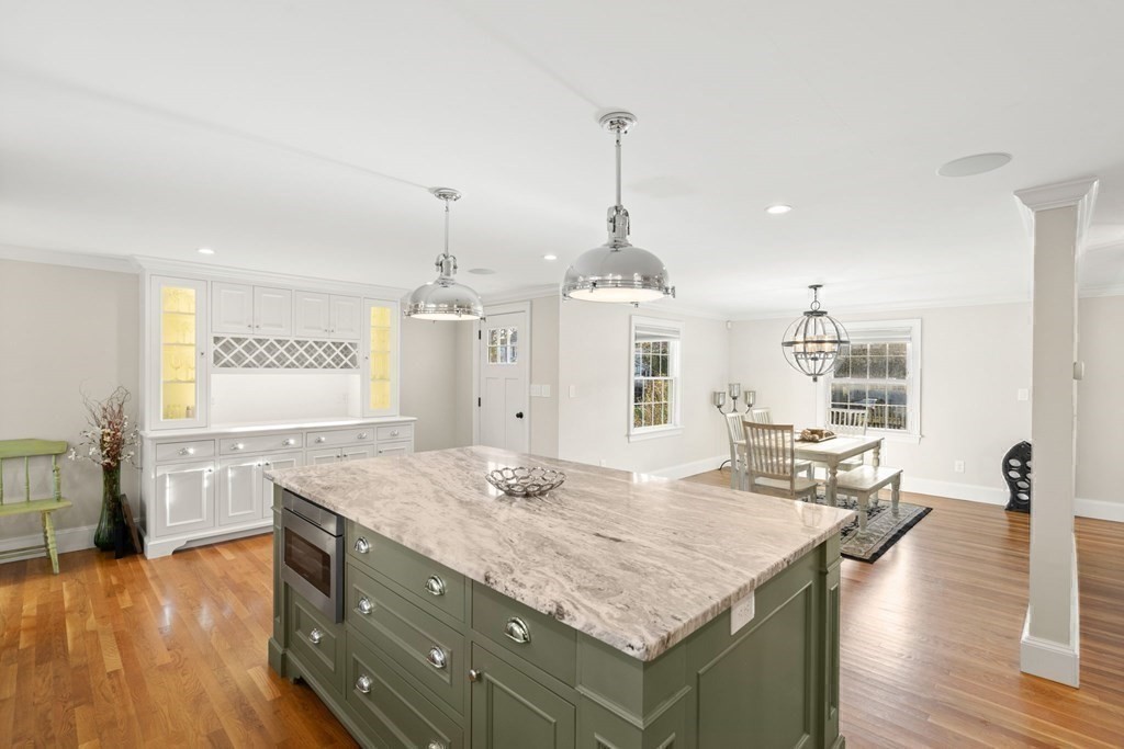 20 Shetland Road Marblehead, MA 01945 - Photo 15 of 40 a kitchen with granite countertop kitchen island stainless steel appliances a sink stove and wooden floor