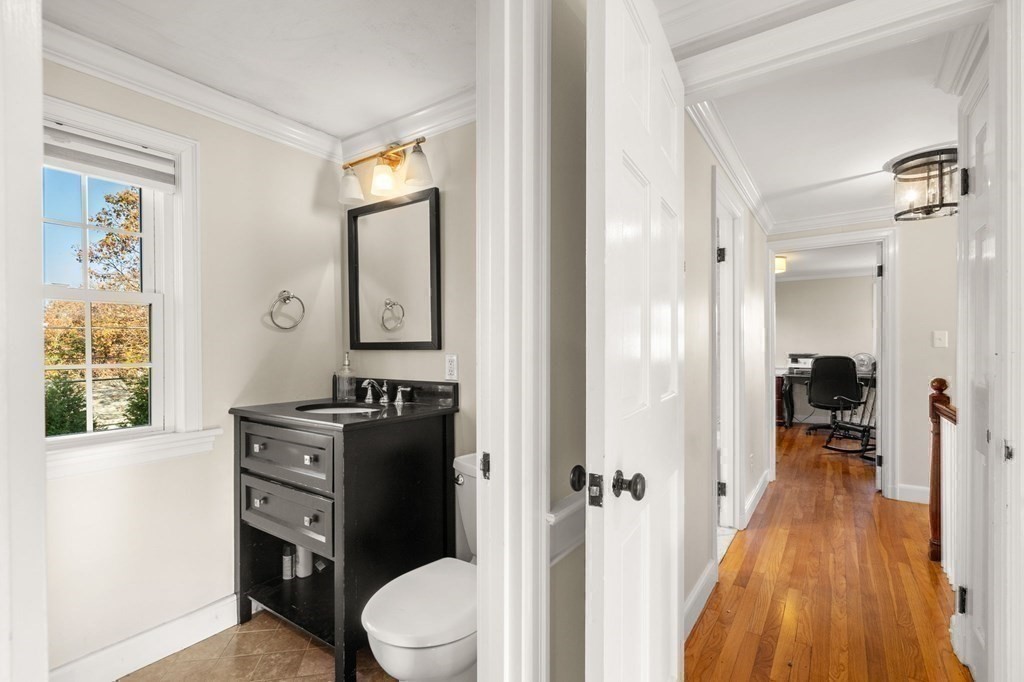 20 Shetland Road Marblehead, MA 01945 - Photo 23 of 40 a bathroom with a toilet sink and mirror