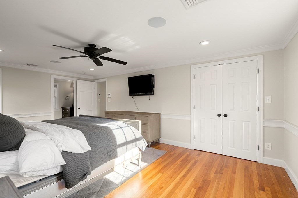 20 Shetland Road Marblehead, MA 01945 - Photo 24 of 40 a spacious bedroom with a bed and a flat screen tv