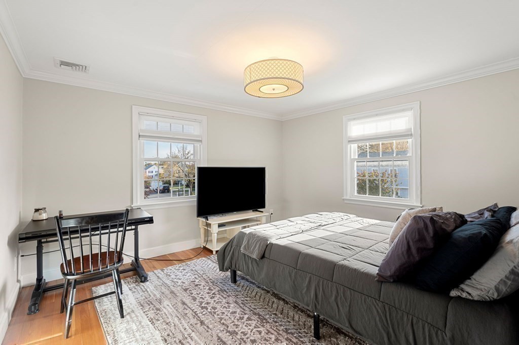 20 Shetland Road Marblehead, MA 01945 - Photo 26 of 40 a bedroom with a bed and a flat screen tv