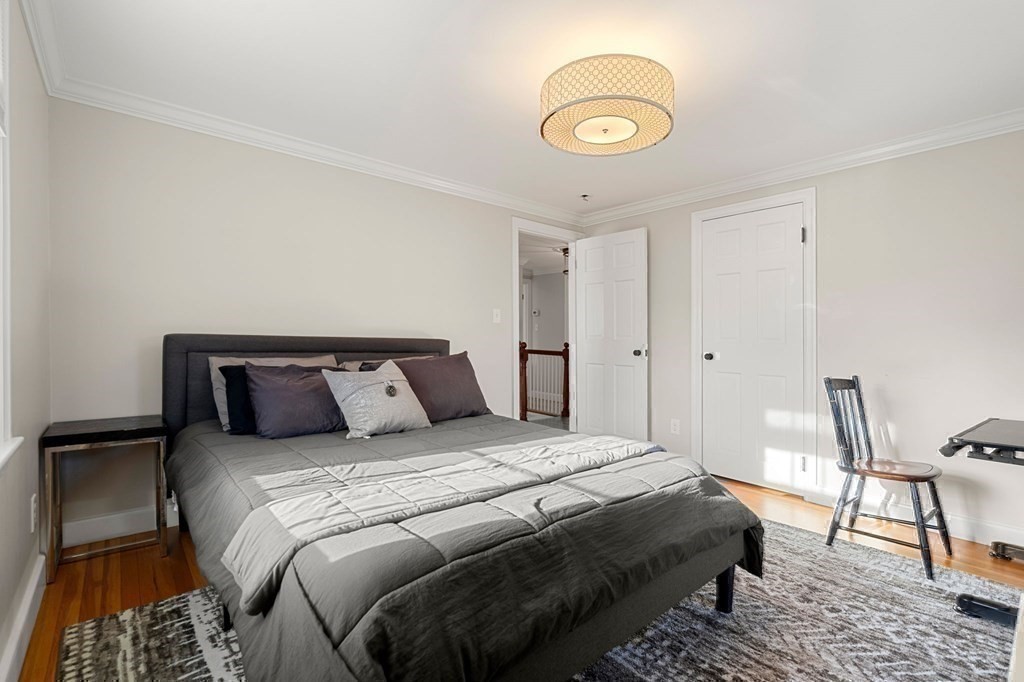 20 Shetland Road Marblehead, MA 01945 - Photo 27 of 40 a bedroom with a bed and a chair