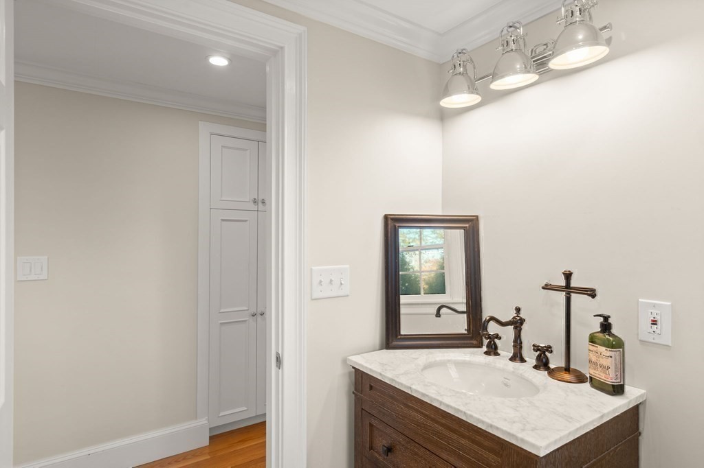 20 Shetland Road Marblehead, MA 01945 - Photo 30 of 40 a bathroom with a sink vanity and a mirror
