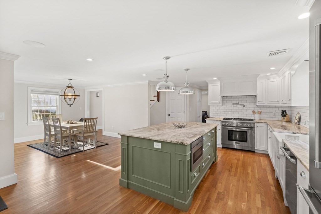 20 Shetland Road Marblehead, MA 01945 - Photo 8 of 40 a kitchen with stainless steel appliances granite countertop a stove and a sink
