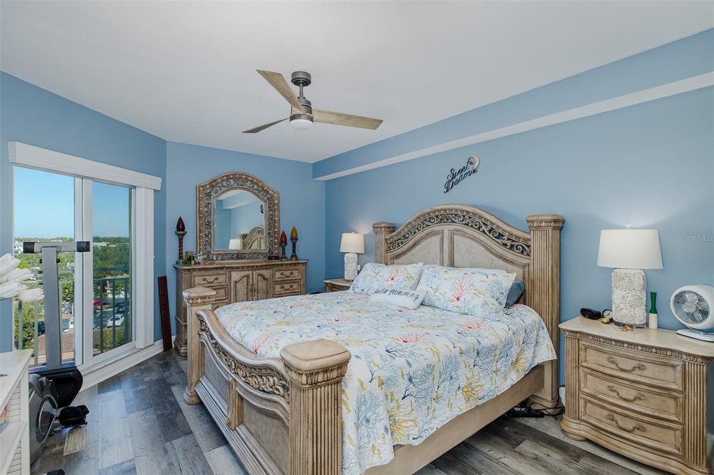 4516 Seagull Drive, Unit 615 New Port Richey, FL 34652 - Photo 13 of 45 a bedroom with a bed and a dresser in it