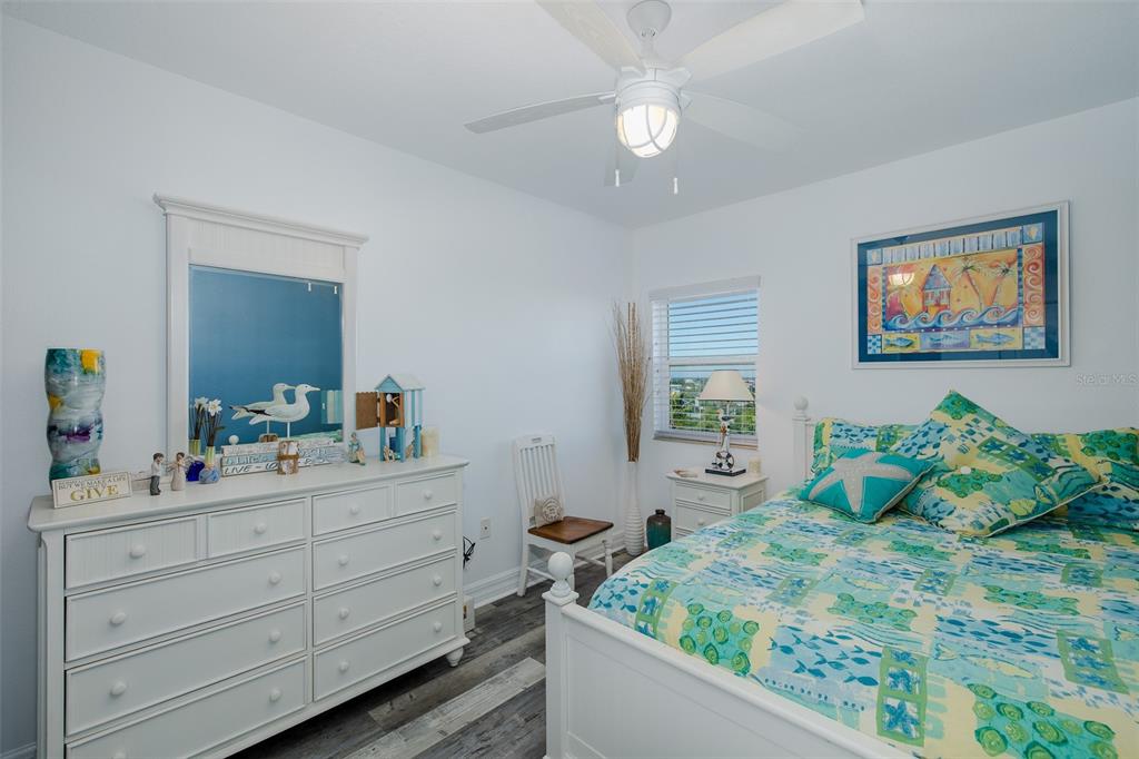 4516 Seagull Drive, Unit 615 New Port Richey, FL 34652 - Photo 18 of 45 a bedroom with a bed and a dresser
