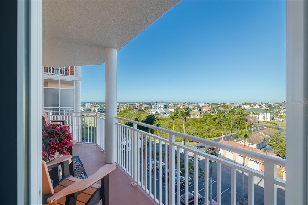 4516 Seagull Drive, Unit 615 New Port Richey, FL 34652 - Photo 23 of 45 a view of a chairs and table in balcony