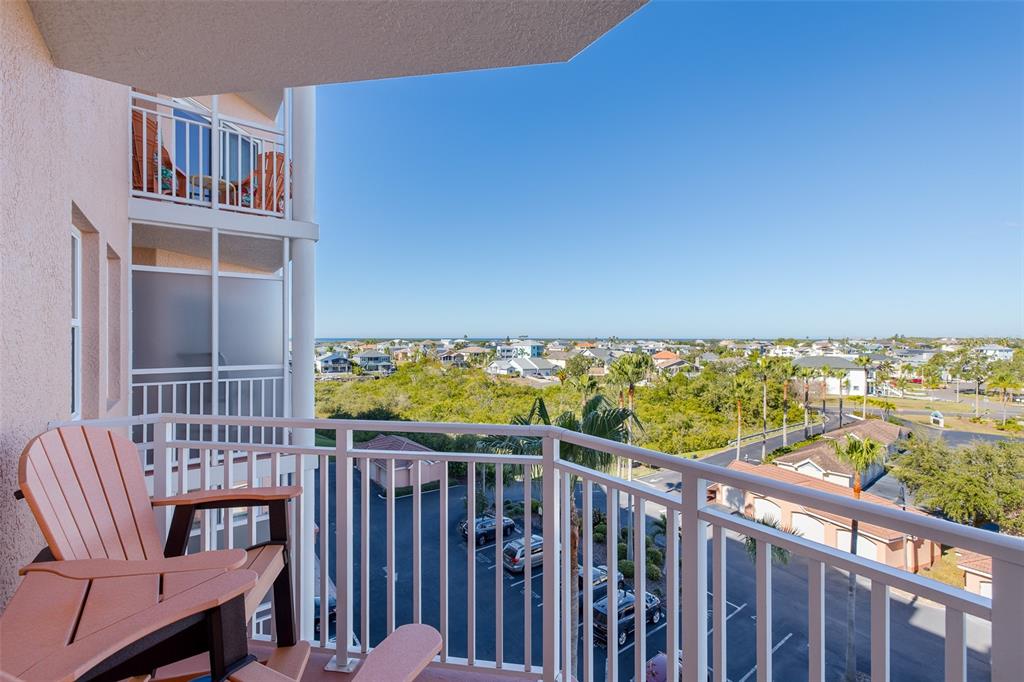 4516 Seagull Drive, Unit 615 New Port Richey, FL 34652 - Photo 24 of 45 a view of a balcony with wooden floor and fence