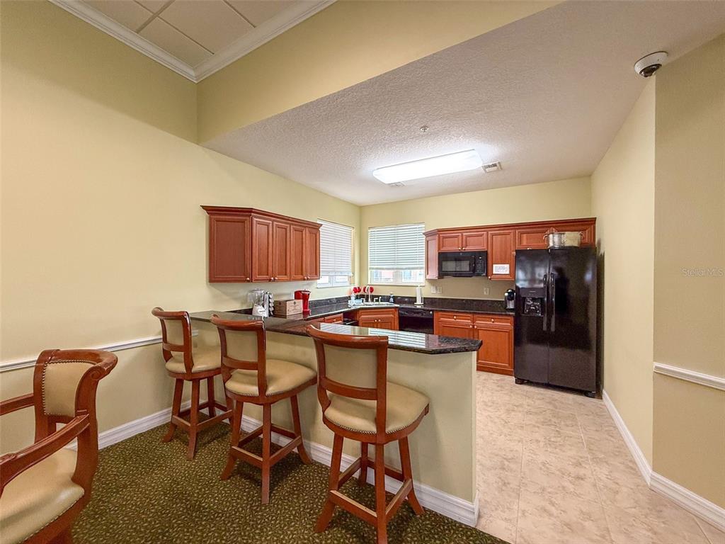 4516 Seagull Drive, Unit 615 New Port Richey, FL 34652 - Photo 29 of 45 a view of a dining room with furniture
