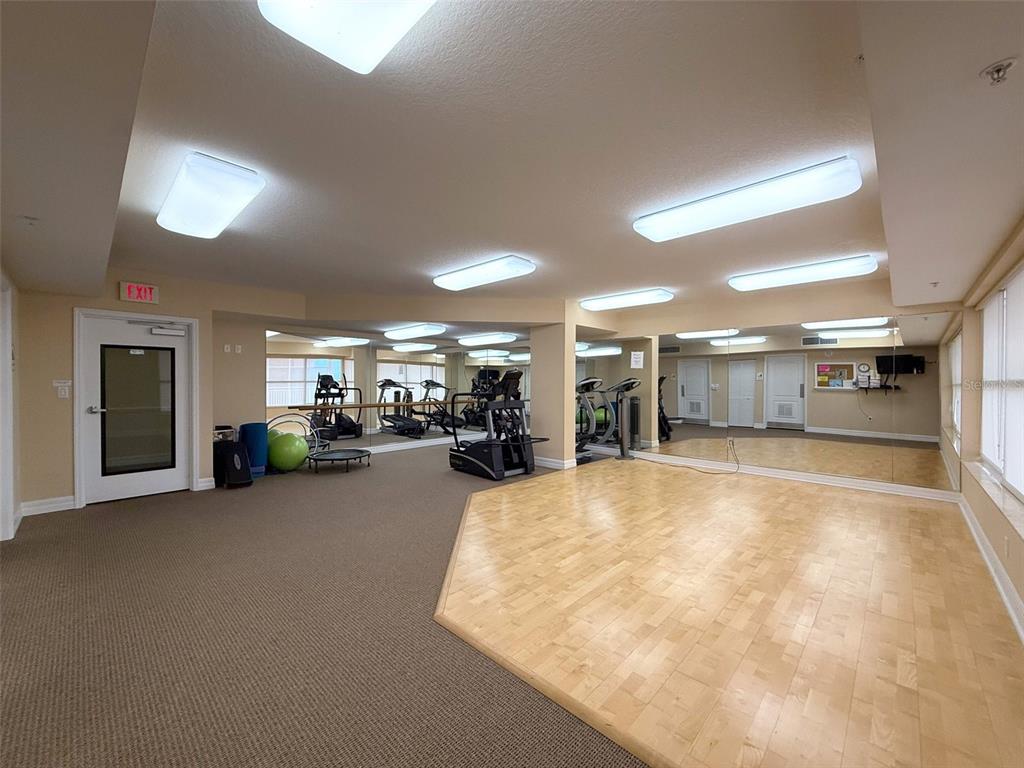 4516 Seagull Drive, Unit 615 New Port Richey, FL 34652 - Photo 35 of 45 a swimming pool with a large window and furniture