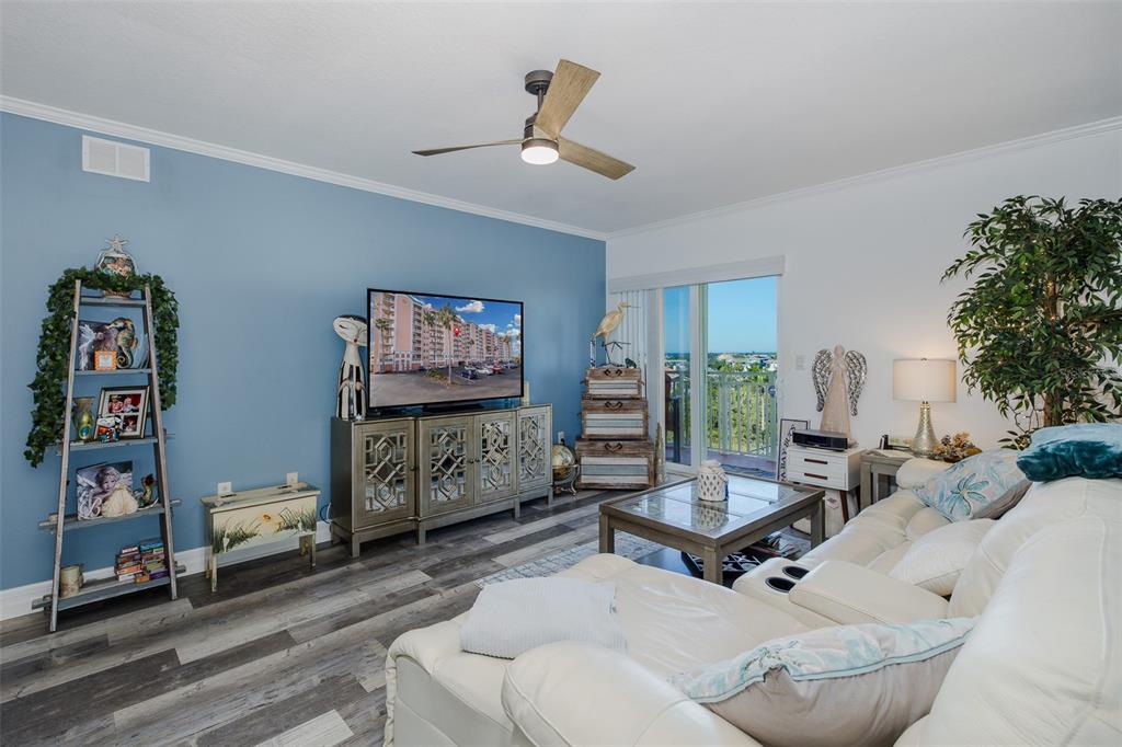4516 Seagull Drive, Unit 615 New Port Richey, FL 34652 - Photo 4 of 45 a living room with furniture and a flat screen tv