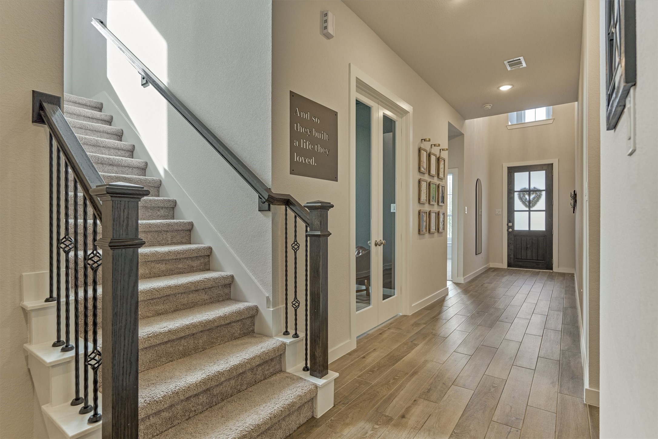 335 Samuels Link Lane Montgomery, TX 77316 - Photo 4 of 45 a view of an entryway with wooden floor and stairs