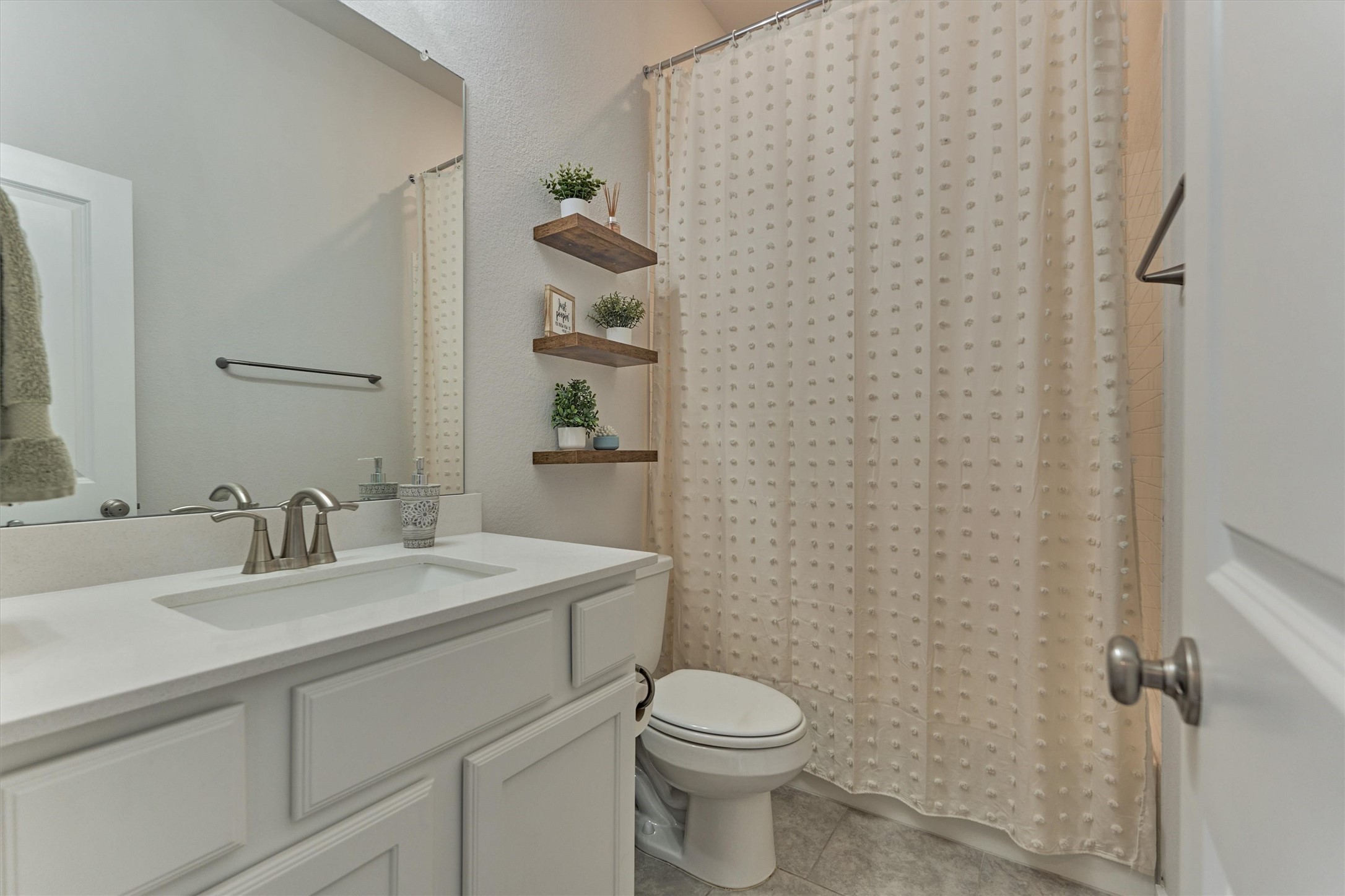 335 Samuels Link Lane Montgomery, TX 77316 - Photo 6 of 45 a bathroom with a sink a toilet and mirror