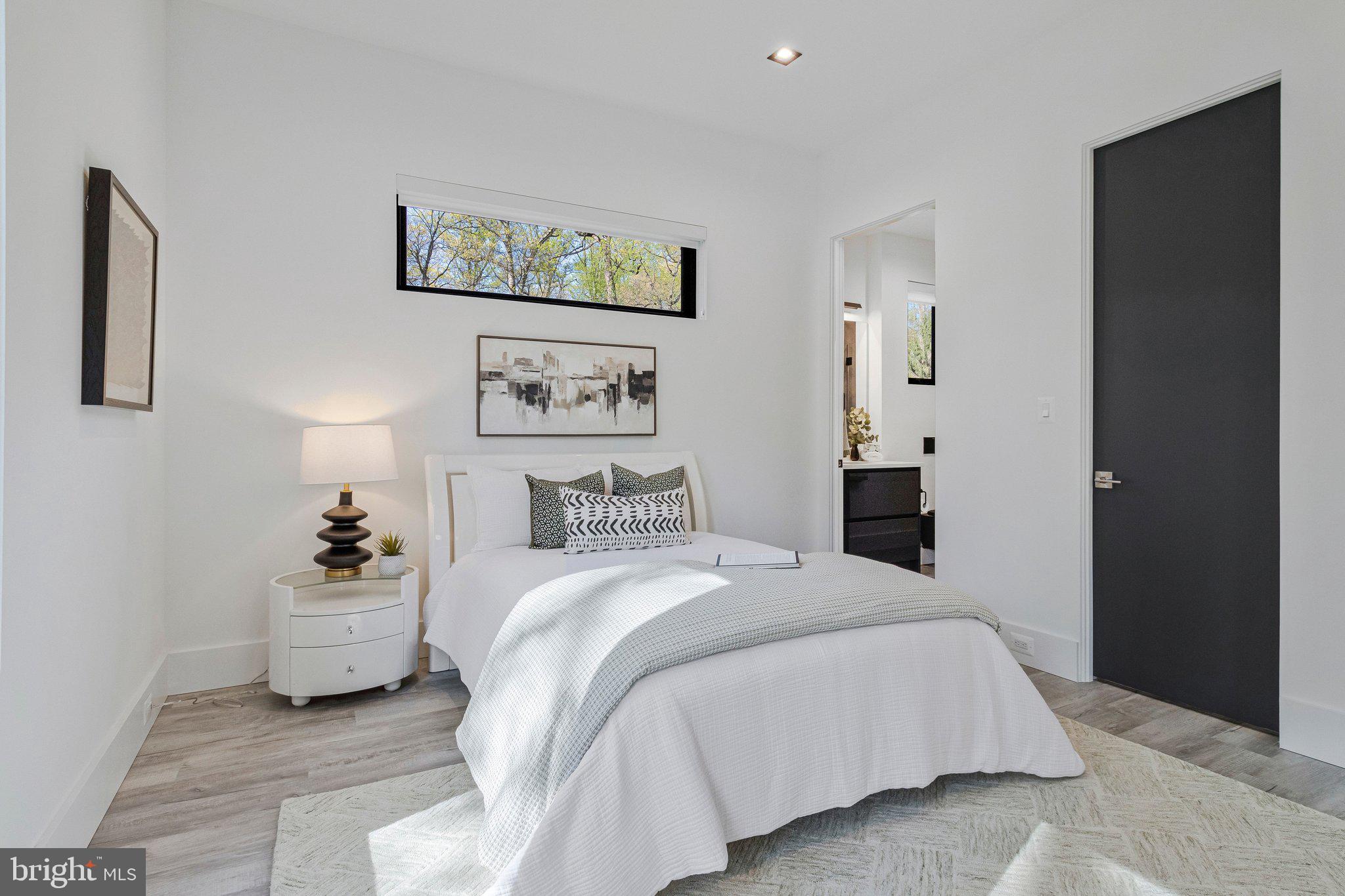 3525 Glenbrook Road Fairfax, VA 22031 - Photo 20 of 111 a bedroom with a bed and wall painting