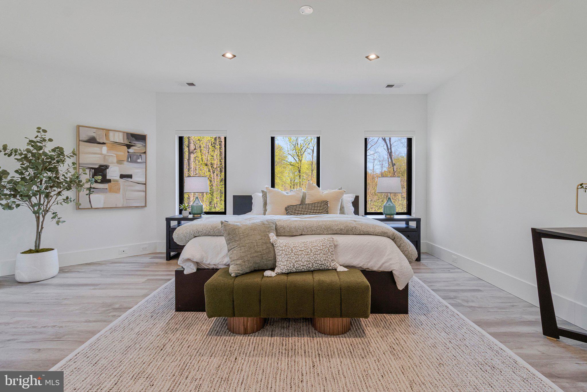 3525 Glenbrook Road Fairfax, VA 22031 - Photo 42 of 111 a bedroom with a large bed and a wooden floor